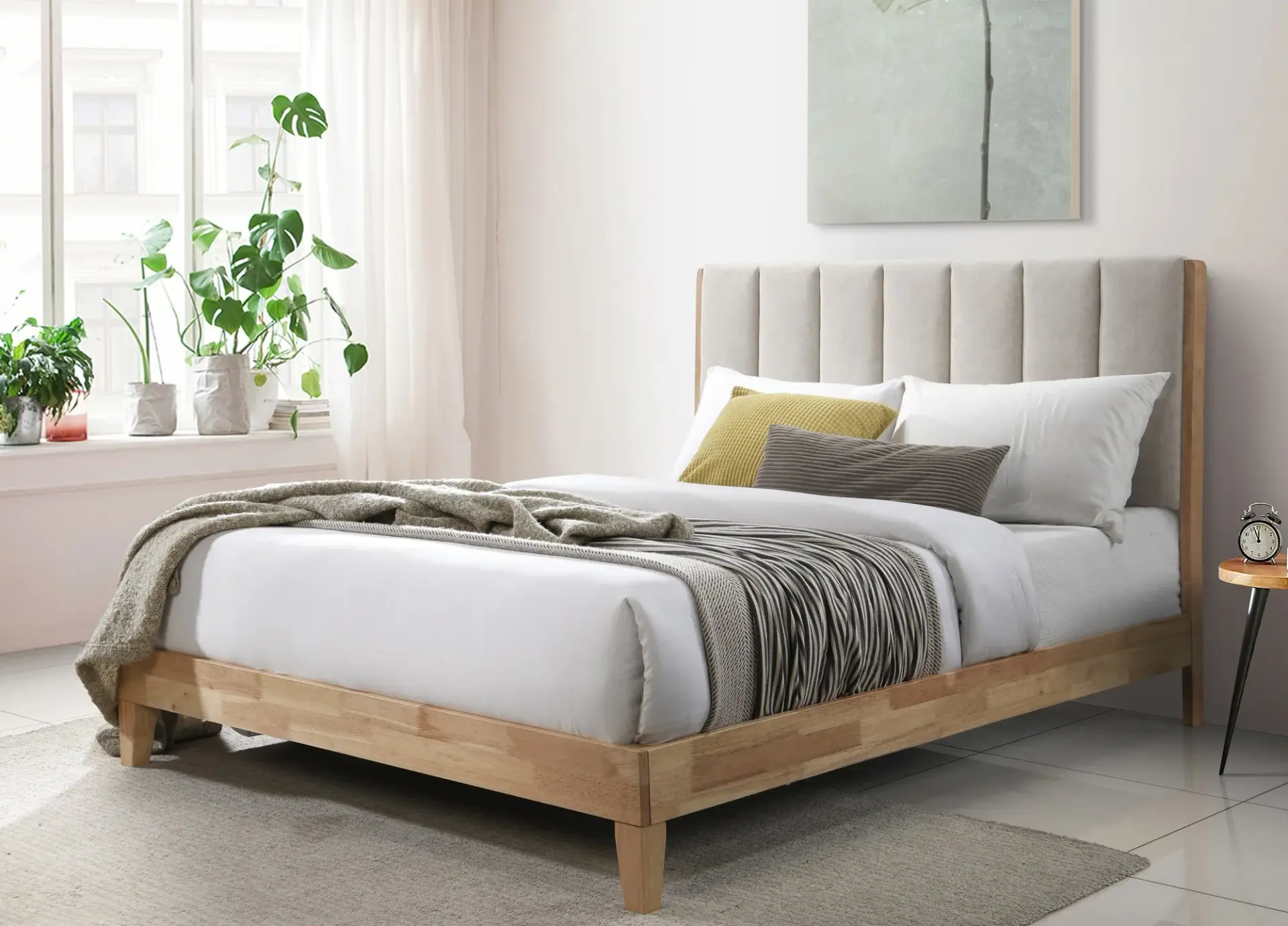 Wooden bed with fabric headboard